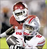  ?? SUE OGROCKI / AP ?? The Buckeyes’ Marshon Lattimore will split time at cornerback today against Rutgers with Denzel Ward and Gareon Conley. Ohio State has returned four picks for TDs this season.