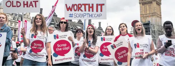  ??  ?? > Nurses and supporters protesting against the Government pay cap in London last month