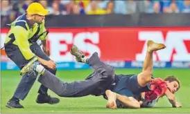  ??  ?? While suspected gamblers and a streaker played spoilsport during the NZ-SL match in Christchur­ch, refugee protesters (in pic) interrupte­d the Australia-England match across the Tasman Sea. AFP PHOTO