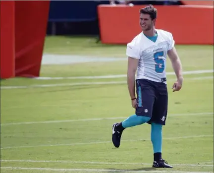  ?? ASSOCIATED PRESS FILE ?? Greg Joseph warms up before a Dolphins practice in May in Davie, Florida.