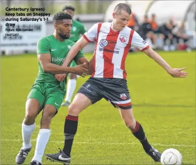  ?? Picture: Ruth Cuerden FM4712457 ?? Canterbury (green) keep tabs on Sheppey during Saturday’s 1-1 draw