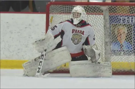  ?? PETE BANNAN – DIGITAL FIRST MEDIA ?? Cardinal O’Hara goalie Troy Percival couldn’t be beaten by a talented Father Judge team Monday night at the Skatium. O’Hara won 3-0.