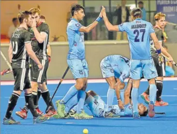  ?? PTI ?? India’s SV Sunil celebrates a goal with Akashdeep during the third place playoff at the Hockey World League in Bhubaneswa­r.