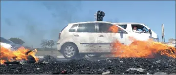  ?? Picture: TRACEY ADAMS ?? CAUSING A JAM: Traffic was disrupted on Strandfont­ein Road as Egoli informal settlement residents burnt tyres during a protest yesterday.