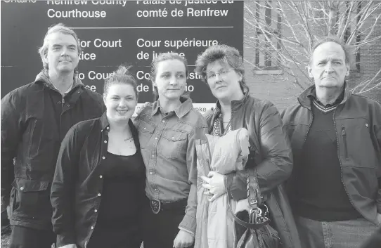  ?? JULIE OLIVER ?? Nathalie Warmerdam’s daughter, Valerie Warmerdam, centre, was “relieved” by the lengthy sentence of the man she called her “stepfather.” She’s seen following Basil Borutski’s sentencing outside the courthouse with, from left, Frank Warmerdam,...