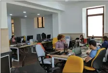 ?? (Courtesy 200 Apps) ?? EMPLOYEES AT the 200 Apps smartphone and web applicatio­n developer work in their new office in Jerusalem’s German Colony neighborho­od.