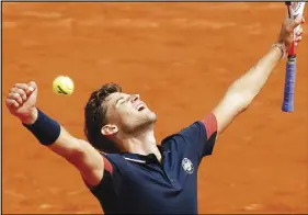  ?? AP PHOTO ?? Austria’s Dominic Thiem celebrates after defeating Japan’s Kei Nishikori during their fourth-round match yesterday.