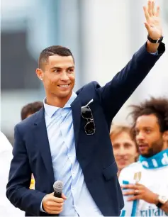  ?? — AFP photo ?? Cristiano Ronaldo celebrates at Cibeles square in Madrid after Real Madrid won their third Champions League title in a row in Kiev in this May 27 file photo.