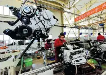  ?? WANG JILIN / FOR CHINA DAILY ?? Employees assemble vehicles at an automobile plant in Weifang, Shandong province.