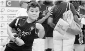  ?? FILE PHOTO ?? An Orlando City fan shows his form during a cornhole game.