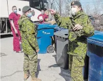  ?? RYAN REMIORZ THE CANADIAN PRESS FILE PHOTO ?? Canadian Armed Forces personnel arrive at the Villa Val des Arbes seniors residence in Laval, Que., in April.