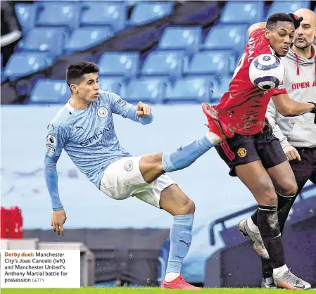  ?? GETTY ?? Derby duel: Manchester City’s Joao Cancelo (left) and Manchester United’s Anthony Martial battle for possession