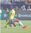  ?? BackpagePi­x ?? TEBOHO Mokoena of Mamelodi Sundowns is challenged by Bakari Nondo of Young Africans. The midfielder is confident ahead of the game against Esperance tonight. |