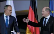  ?? EBRAHIM NOROOZI — THE ASSOCIATED PRESS ?? German Chancellor Olaf Scholz, right, and Poland’s Prime Minister Donald Tusk attend a press conference in Berlin, Germany, Monday.