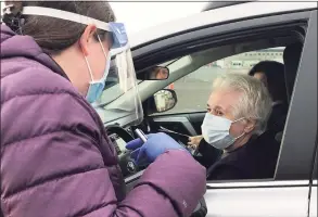  ?? Dan Haar / Hearst Connecticu­t Media ?? Community Health Center Inc. opened the state’s first and largest large-scale outdoor COVID-19 vaccinatio­n clinic Sunday on a runway at the long retired Pratt & Whitney airport at Rentschler Field in East Hartford.