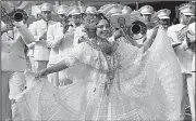  ?? AP/ARNULFO FRANCO ?? A woman wearing the Panamanian traditiona­l-style dress known as “Pollera” dances Thursday during an independen­ce day parade in La Chorrera, Panama. Panama is celebratin­g 198 years of independen­ce from Spain.
