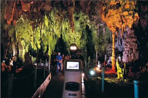  ??  ?? Persephone guides visitors Aug. 2 inside Alistrati Cave.