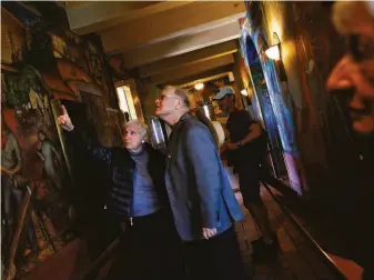  ?? Lea Suzuki / The Chronicle 2012 ?? Ruth Gottstein, daughter of artist Bernard Zakheim, looks at murals with Gray Brechin, project scholar at UC Berkeley’s Living New Deal Project, during a visit to S.F.’s Coit Tower in 2012.