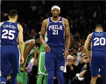  ?? MITCHELL LEFF / GETTY IMAGES ?? A strategy of losing big to get lottery picks enabled the 76ers to select guard Ben Simmons, center Joel Embiid (21) and guard Markelle Fultz high in the draft. Embiid has a fractured orbital bone that reportedly will keep him out for today’s Game 1.