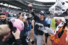  ?? MATT MARTON/THE ASSOCIATED PRESS ?? Milwaukee Brewers centre-fielder Christian Yelich celebrates after the Brewers defeated the Chicago Cubs 3-1 in a tiebreaker baseball game Monday to claim the NL Central title.