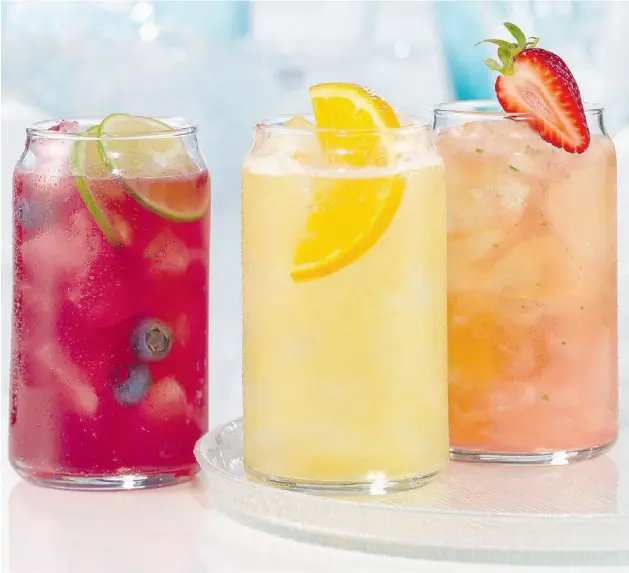  ??  ?? Casey’s Grill Bar Let guests create their own drinks by providing all the ingredient­s and recipes for, say, Blueberry Cider Sangria, left, Shock Top Margarita and Strawberry Mojito.