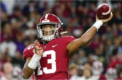  ?? ap file pHotos ?? BREAKING THE MOLD: Tua Tagovailoa will probably become the first left-handed quarterbac­k to start a game in the NFL since Kellen Moore in 2015.