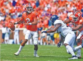  ?? AP PHOTO/RICHARD SHIRO ?? Clemson quarterbac­k Kelly Bryant looks to pass under pressure from Georgia Southern’s Lane Ecton during a 38-7 home win last Saturday. The Tigers are on the road for their ACC opener today against Georgia Tech.