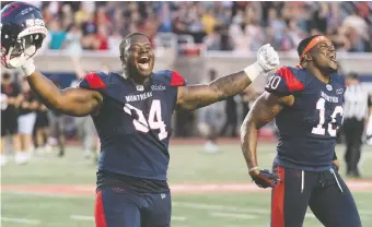  ?? GRaHAM HUGHES/THE CANADIAN PRESS FILES ?? Fabion Foote, left, and Henoc Muamba celebrate after defeating the Blue Bombers last month. Foote has been part of a rotation on the Als’ defensive line, playing frequently.