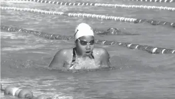  ?? KRISTINE JOYCE CAMPAÑA ?? Justine Reign Garido of Team Cebu City finished first in the secondary girls 100 meter breast stroke event during the swimming competitio­n of the 2015 CVIRAA yesterday at the Cebu City Sports Center pool.