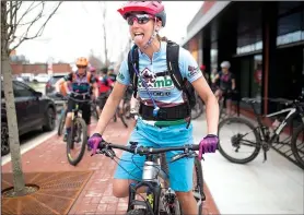  ?? NWA Democrat-Gazette/CHARLIE KAIJO ?? Riders take off for an all-women’s bike ride Friday.