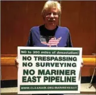  ?? DIGITAL FIRST MEDIA FILE PHOTO ?? Middletown resident Randall Sampson, whose two grandsons are future students at Glenwood Elementary School, held a sign in opposition to the proposed pipeline at a recent Rose Tree Media School Board meeting.