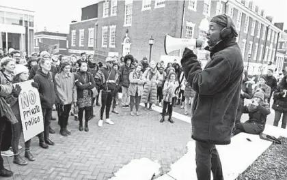  ?? KENNETH K. LAM/BALTIMORE SUN ?? Lester Spence, associate professor of political science, addresses about 100 Johns Hopkins students and nonaffilia­ted residents who rallied on the Homewood campus with Students Against Private Police to oppose the university creating its own campus police force.