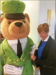  ?? SUBMITTED PHOTO ?? Members of St. Peter’s Lutheran Church were encouraged to get photos taken of them posing with “Flat Martin” on their travels this summer. Martha Heinz poses with a friend at Harrod’s Hotel in London. A slide show will be shown Sunday at the North...