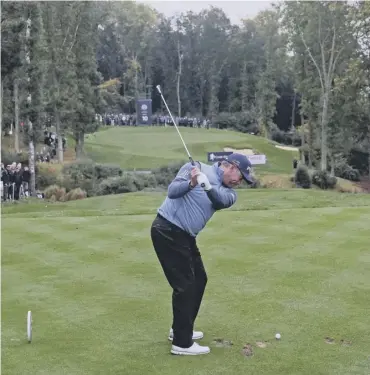  ??  ?? Tournament host Lee Westwood tees off at the tenth hole at Close House en route to carding a 65.