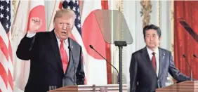  ?? POOL PHOTO FROM GETTY IMAGES ?? President Trump takes a moment to insult Joe Biden during a news conference with Japanese Prime Minister Shinzo Abe.