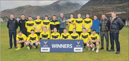  ?? Photograph­s: Neil Paterson. ?? Fort William captain Arran MacPhee receives the Mowi National Division Trophy from Rob Woodward of Mowi.