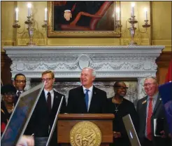  ?? The Associated Press ?? SIGNING DAY: Arkansas Gov. Asa Hutchinson speaks Tuesday in the governor’s conference room inside the state Capitol in Little Rock before signing a bill moving the state’s Robert E. Lee holiday to October. Until Hutchinson signed the bill, Arkansas had...