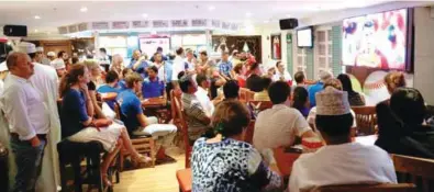  ?? Shabin E/TIMES OF OMAN ?? KEEN INTEREST: People watch the Euro 2016 final soccer match between Portugal and France, on Sunday at a hotel in Muscat. Portugal won 1-0. -