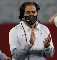 ??  ?? Alabama will look to claim its sixth national championsh­ip under Coach Nick Saban since 2009 when it takes on Ohio State tonight at Hard Rock Stadium in Miami Gardens, Fla. (AP/Ron Jenkins)