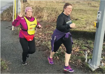  ?? GORD KURENOFF ?? Sandra Jongs Sayer, right, works out with Sun Run InTraining leader Danette Haar in last year’s Run10KStro­nger program at W.C. Blair in Langley. Sayer has graduated to clinic co-ordinator this year.