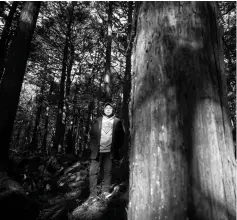  ??  ?? Watanabe poses for a photo in Aokigahara Forest.