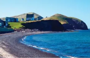  ??  ?? The beach at La Grave on the Îles de la Madeleine in the Gulf of the St. Lawrence is rugged, picturesqu­e and historic.