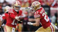  ?? Tribune News Service ?? San Francisco 49ers starting quarterbac­k Brock Purdy (13) hands off to San Francisco 49ers’ Christian Mccaffrey (23) against the Tampa Bay Buccaneers.