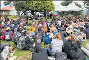  ??  ?? STUDENTS being briefed by Dean Flavell before setting off to collect and plant native trees around Makahae Marae.