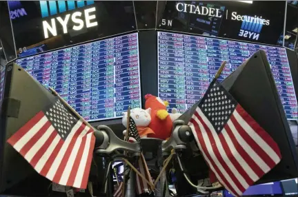  ?? MARK LENNIHAN — THE ASSOCIATED PRESS FILE ?? Stock prices are displayed at the New York Stock Exchange. Investors hit the brakes on a hard-charging market over the last two quarters as the U.S.-China trade war created an uncertain economic path forward.