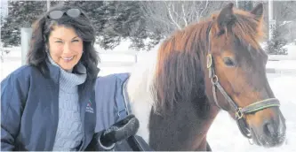  ?? JOE GIBBONS/THE TELEGRAM ?? Kelly Sandoval, executive director of Rainbow Riders, with Mollie, one of the horses at the organizati­on’s facility on Mount Scio Road, on Wednesday.