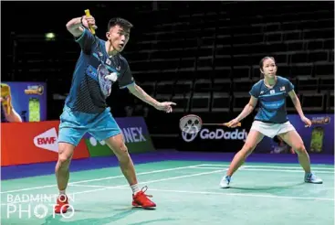  ?? ?? Vital win: Hoo pang ron (left) and Cheah yee see stunned world No. 7 marcus ellislaure­n smith of england 21-19, 21-18 in the mixed doubles tie of their Group d opener of the sudirman
Cup. — pic courtesy of badminton photo.