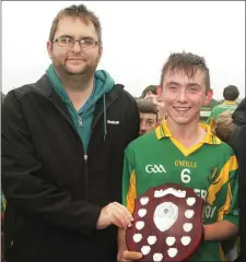  ??  ?? Dean Goodison with triumphant captain Eoghan Doyle.