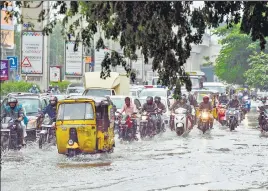  ?? ?? Motorists make their way through a water-logged street amid heavy rains in Hyderabad on Monday, the morning after cyclone Gulab made landfall.