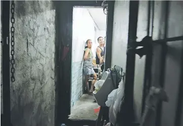  ??  ?? Photo shows people allegedly kept inside a hidden room at the Drug Enforcemen­t Unit of the Manila Police Department’s Police Station 1 in the Tondo area of Manila. — AFP photo